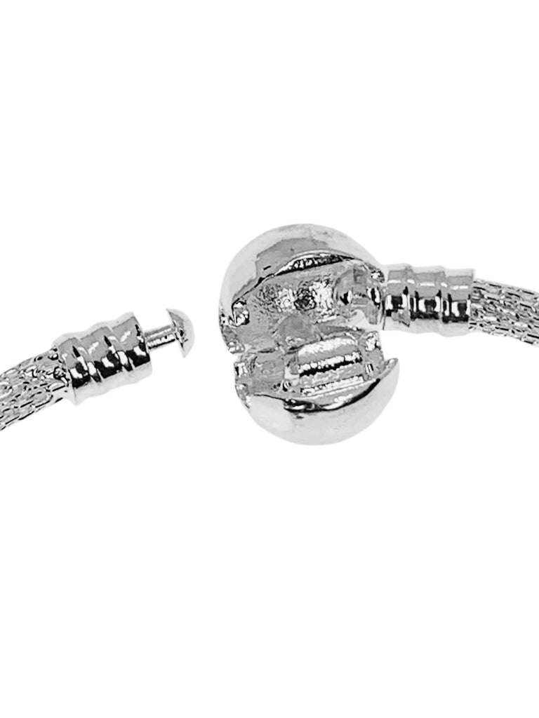 Bling Bangle Clasp is easy to open. Just slide your nail in and lever it open. When closing, simply line up the tiny mushroom head until it sits into the little cradle of the Ball Clasp and then snap it closed.  